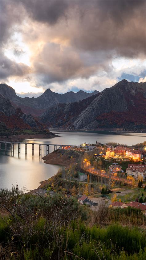 Ria O Cityscape Autumn Sunset With Mountain Range Picos De Europa