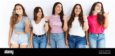 Group Of Women Wearing Casual Clothes Standing Over Isolated Background