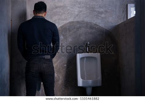 Zdjęcie stockowe Handsome Man Peeing Toilet Bowl Restroomurinals