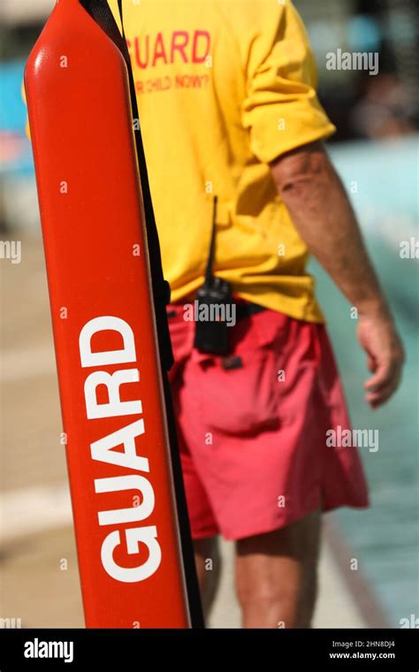 A Public Pool Life Guard Or Pool Safety Officer In Uniform Standing