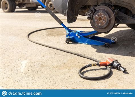 Hydraulic Car Jack Lift The New Car For Change The Tyre Stock Photo