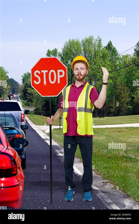 Workman Holding Stop Sign Hi Res Stock Photography And Images Alamy