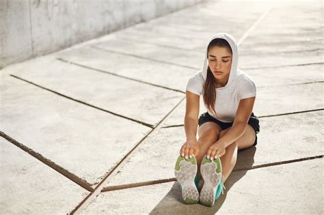 Premium Photo Beautiful Female Athlete Stretching Before Workout