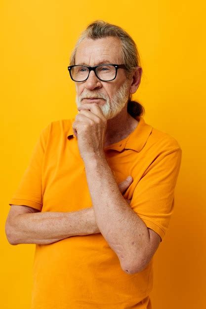 Premium Photo Photo Of Retired Old Man Posing Yellow Tshirt Glasses