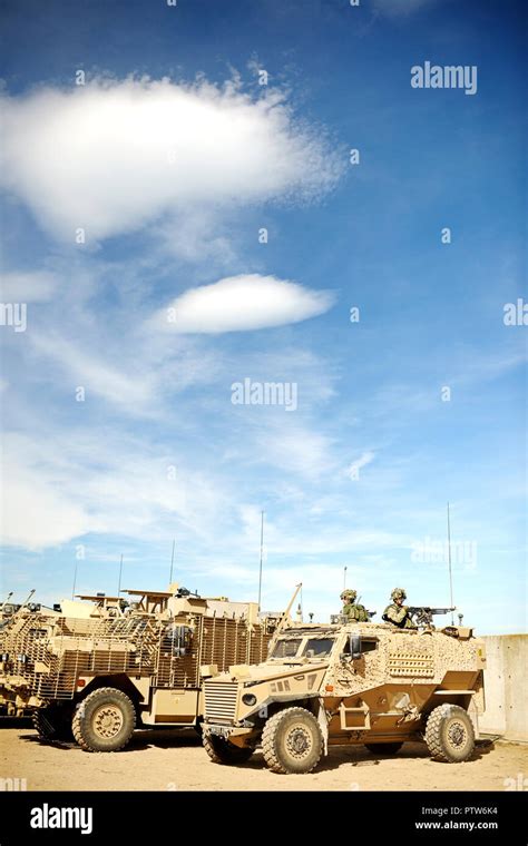 Desert camouflage armoured vehicles at base Stock Photo - Alamy