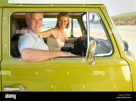 Mature Couple Sat In Camper Van Stock Photo Alamy