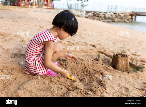 Asian Chinese Little Girl Playing Sand At Beach Outdoor Stock Photo Alamy