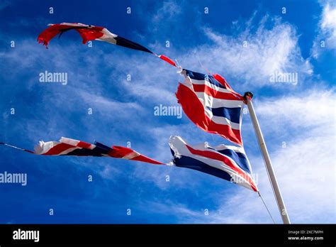 Torn British Flag In The Wind Stock Photo Alamy