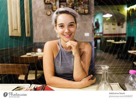 Young woman posing in a bar - a Royalty Free Stock Photo from Photocase