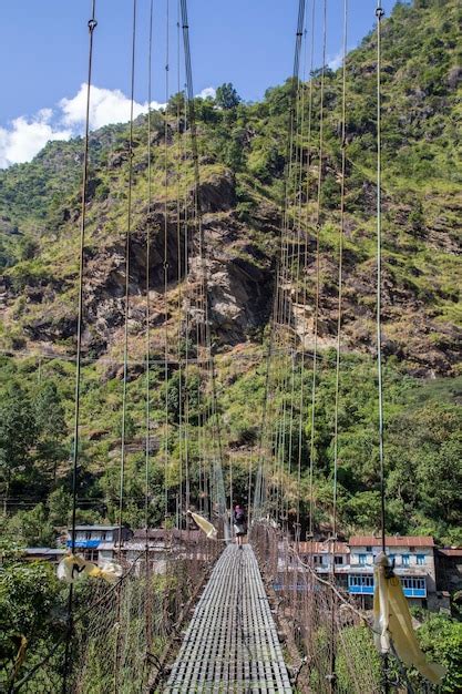 Premium Photo Suspension Bridge On Annapurna Circuit Nepal Person