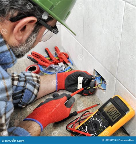 Electrician Technician Working Safely On A Residential Electrical