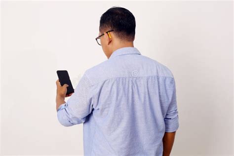 Back View of Adult Asian Man Wearing Bright Blue Shirt Looking To ...