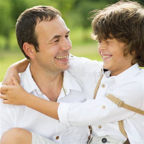 father  son stock photo image  meadow laugh child