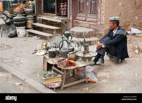 An Uyghur Man Selling Various Bits Of Hardware In Kashgar S Old Town