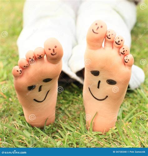 Smileys on toes and soles stock photo. Image of smiling - 34730348