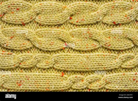 Texture Of Wool Knit Color Of Mustard Fabric Interspersed With Red