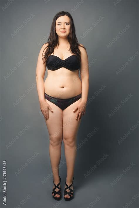 Beautiful Overweight Woman In Black Bikini On Grey Background Stock