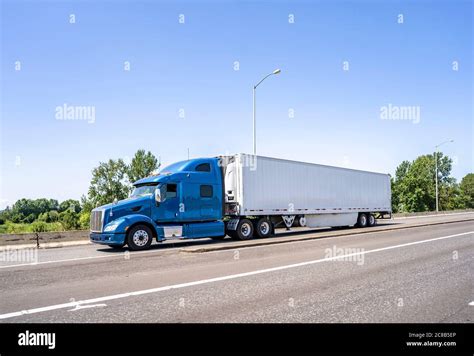 Big Rig Blue Bonnet Semi Truck With High Cab And Long Refrigerator Semi