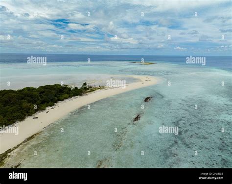 Aerial Drone Of Island With Beach And Coral Reef In The Tropics Pom