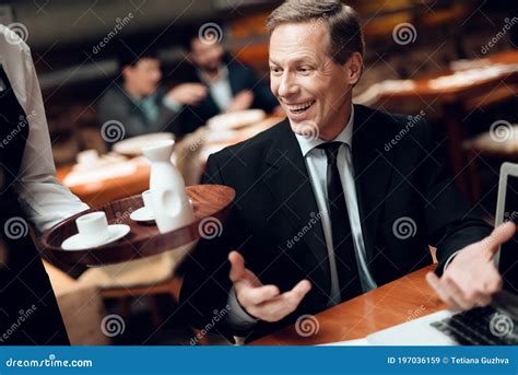 A Man Waited For Coffee In A Restaurant At A Table Stock Image Image