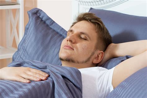 Cute Young Man Sleeping On Bed In The Morning Stock Photo Image Of