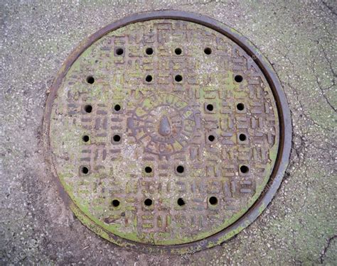 Kentucky Electric Manhole Cover Mossy Green Iron Plate Stock Images