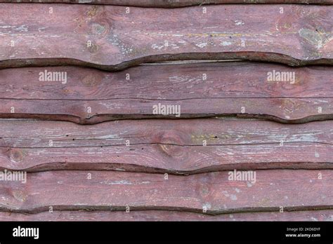 Fence Made Of Rough Old Wooden Boards With Peeling Dark Brown Paint