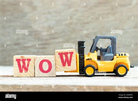 Toy Forklift Hold Letter Block W To Complete Word Wow On Wood