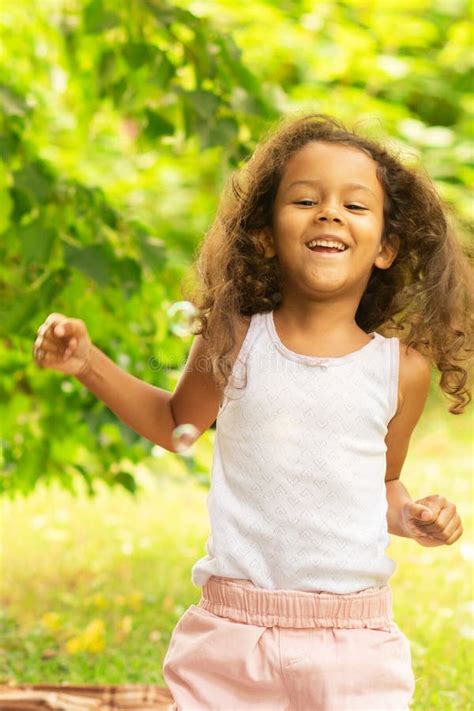 Happy African American Kid Outdoor Girl Blowing Bubbles Child Playing