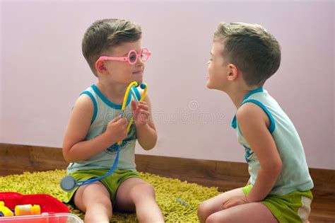 Twin Brothers Play In Doctor Stock Photo Image Of Identical Blue