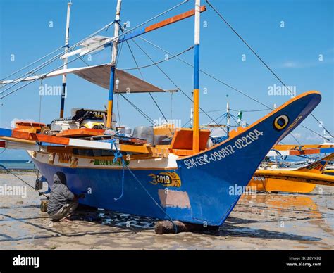 Maintenance Work Being Done On A Traditional Fishing Boat With