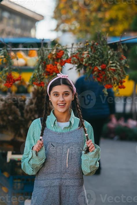 Playful farmer woman in denim overalls smiling sincerely while posing. 15498034 Stock Photo at ...