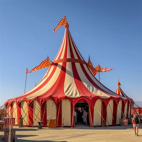 A Large Red And White Circus Tent With Flags