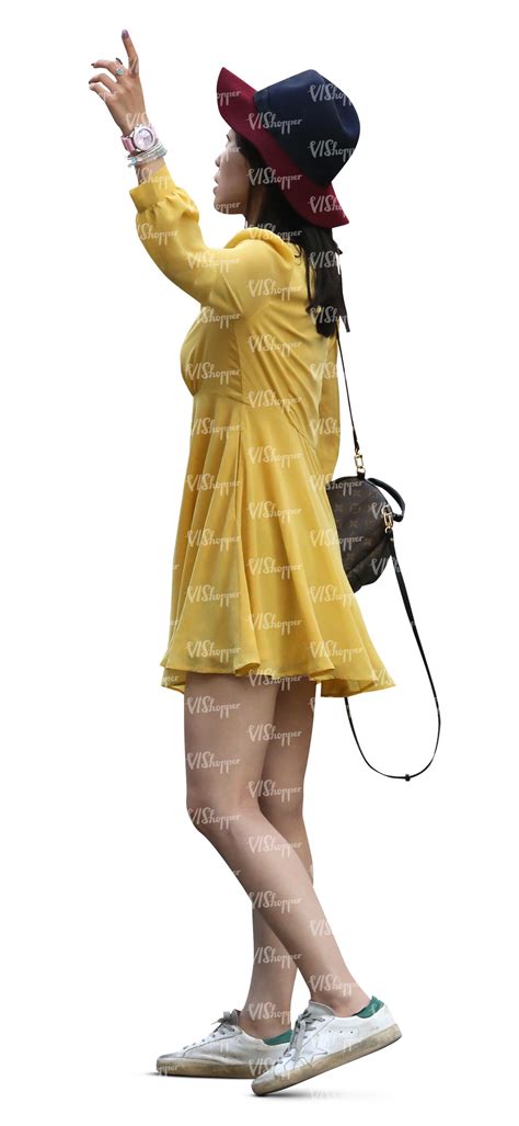 Asian Woman In A Yellow Summer Dress Standing Vishopper