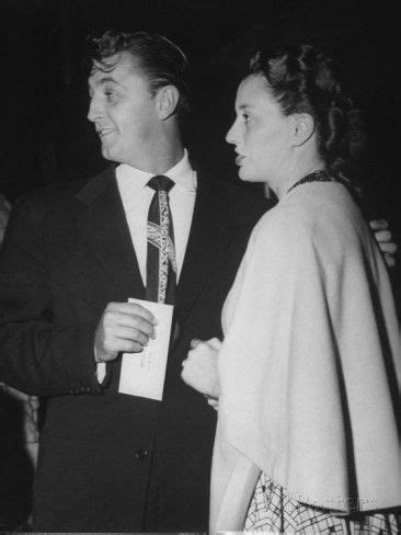 Robert Mitchum With Arm Around Wife Dorothy Tickets In Hand At