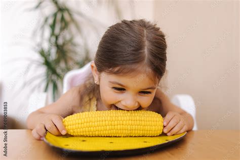 Adorable Little Girl Eating Corn At Home Cute Kid Tree Year Old Eat