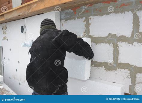 A Building Contractor Is Installing An External Solid Wall Insulation