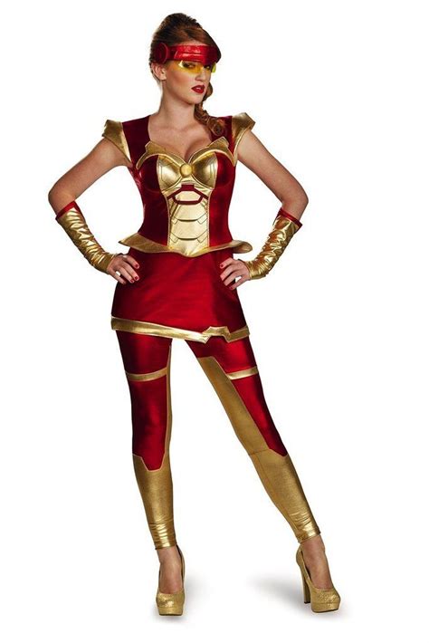 A Woman In A Red And Gold Costume Posing For The Camera With Her Hands On Her Hips