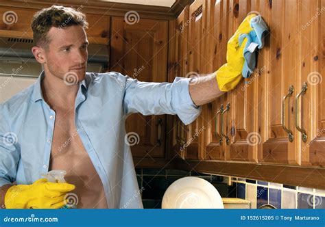 Man Wearing Yellow Rubber Gloves Cleaning Kitchen Stock Image Image