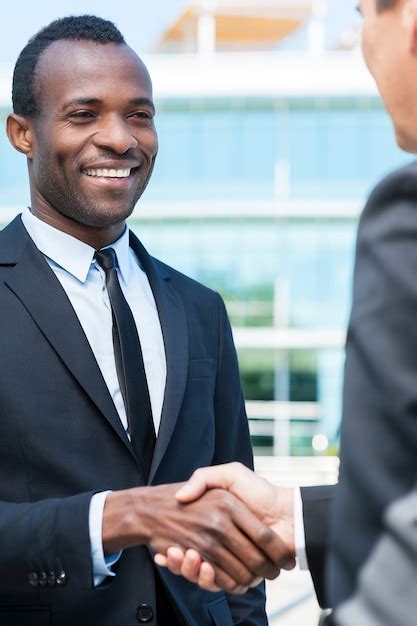 Premium Photo | Business people shaking hands. Two business men shaking ...