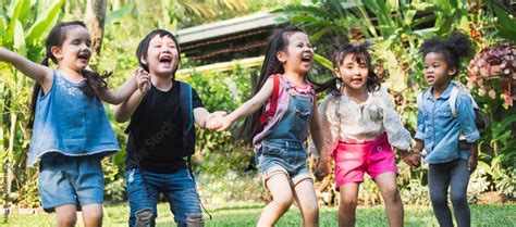 Diversity kids holding hands and playing at outdoor park Stock Photo ...