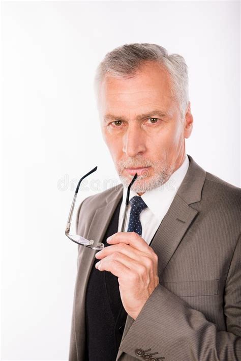 Handsome Old Businessman In An Elegant Suit With Glasses Stock Photo