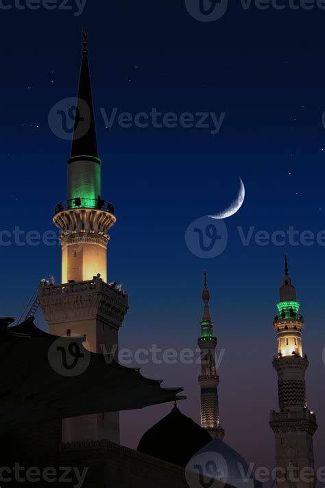 A mosque with the full moon in the sky. Masjid nabi of Medina, mosque ...