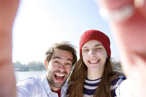 Premium Photo Young Couple Having Fun And Taking Selfie