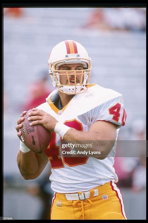 Running back Mike Alstott of the Tampa Bay Buccaneers looks to pass ...