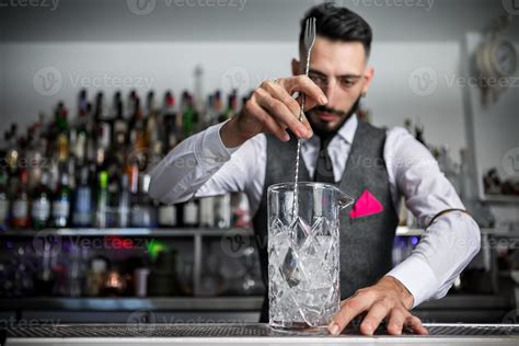 Bartender Mixing Cocktail In Glass 6668954 Stock Photo At Vecteezy