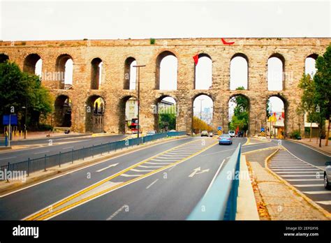 Traffic passing under an aqueduct, Valens Aqueduct, Istanbul, Turkey ...