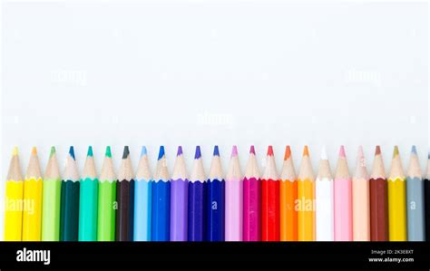 Colored Pencil Crayons In A Row On White Background Stock Photo Alamy