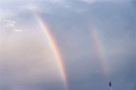 Premium Photo | Double colorful rainbow in sky