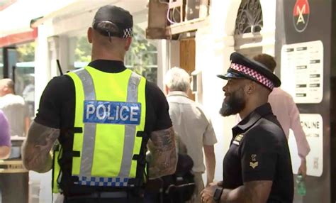 London Police Officers Patrolling Main Street As Part Of RGP Training